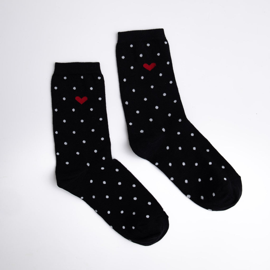 Black socks with white dots and red heart on a white background

