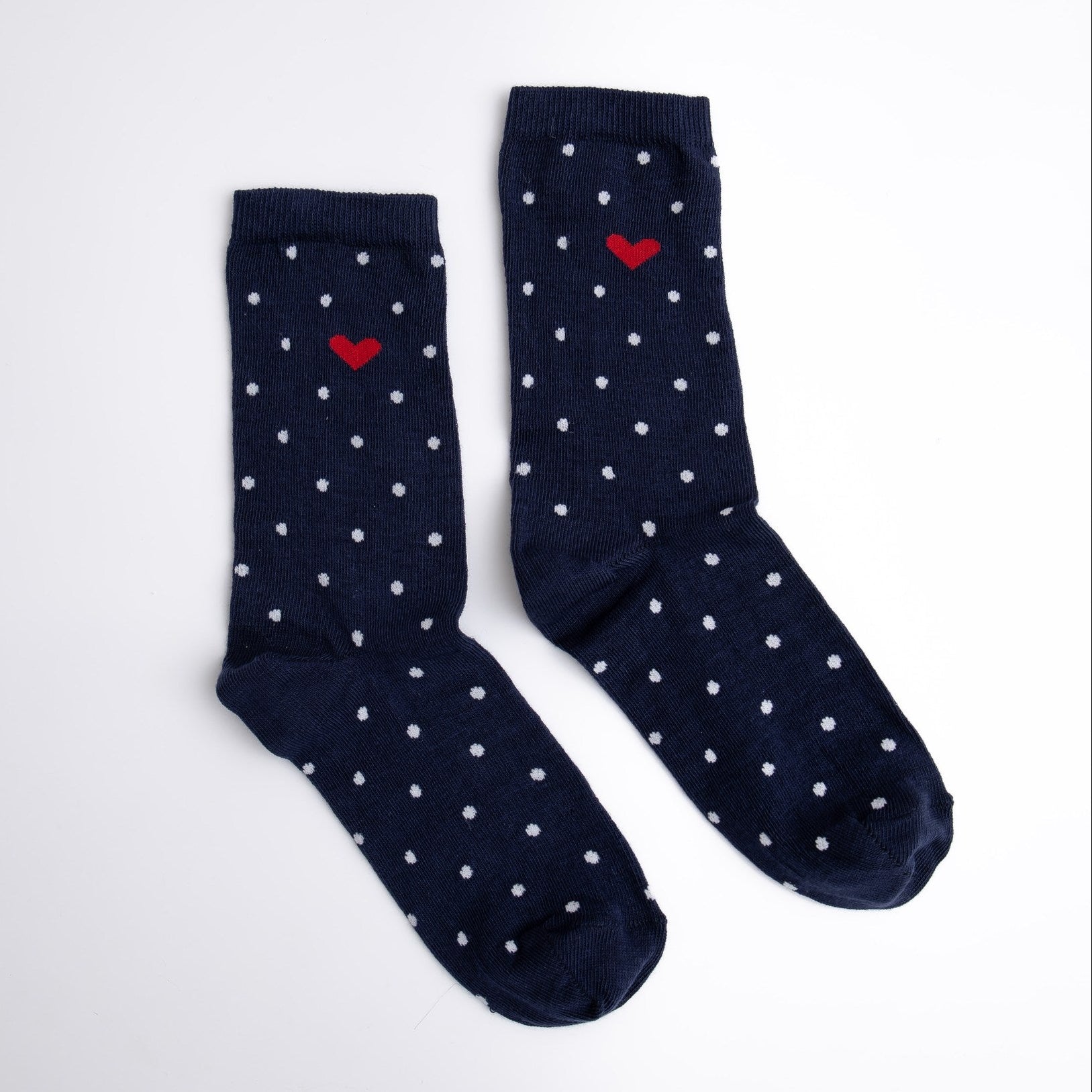 Navy socks with white polka dots and red hearts on a white background


