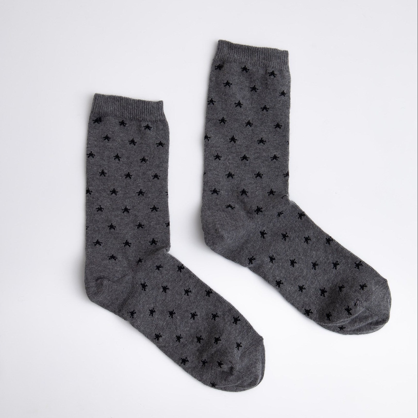 Pair of gray socks with black star pattern on a white background

