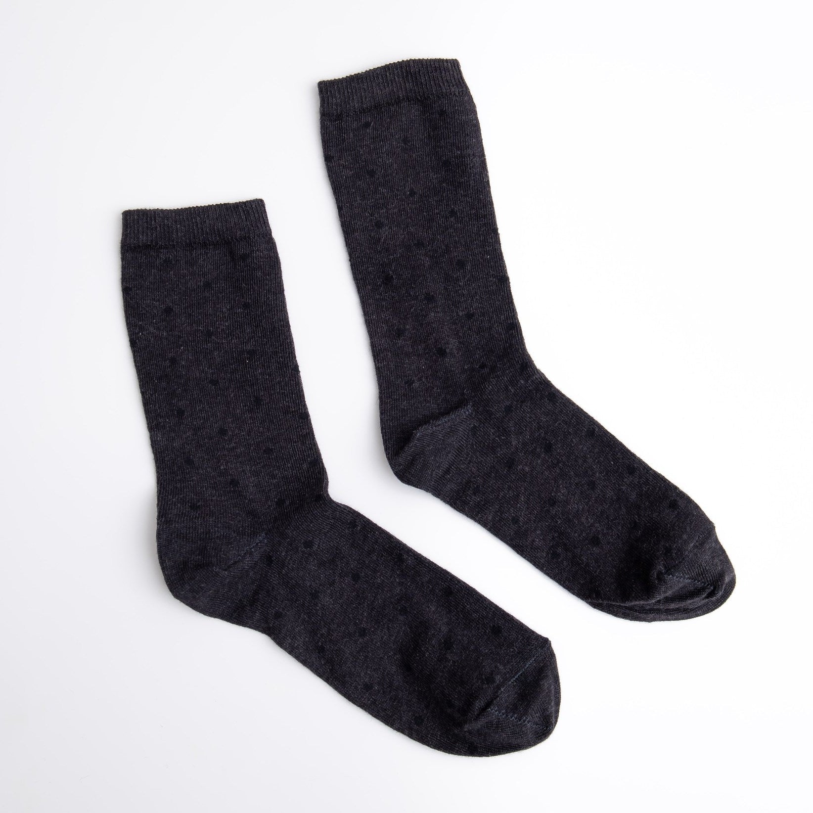 Pair of dark gray socks on a white background

