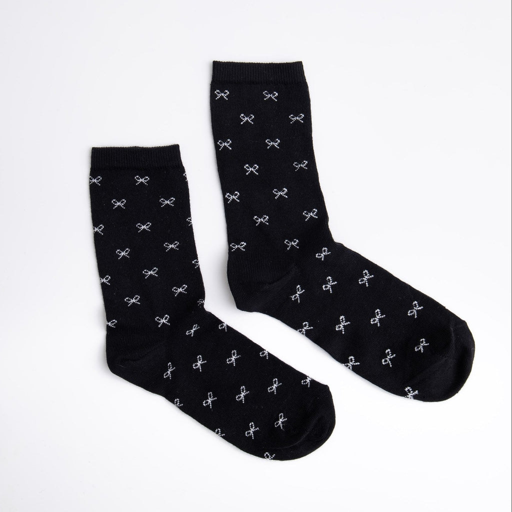 Black socks with white patterns on a white background

