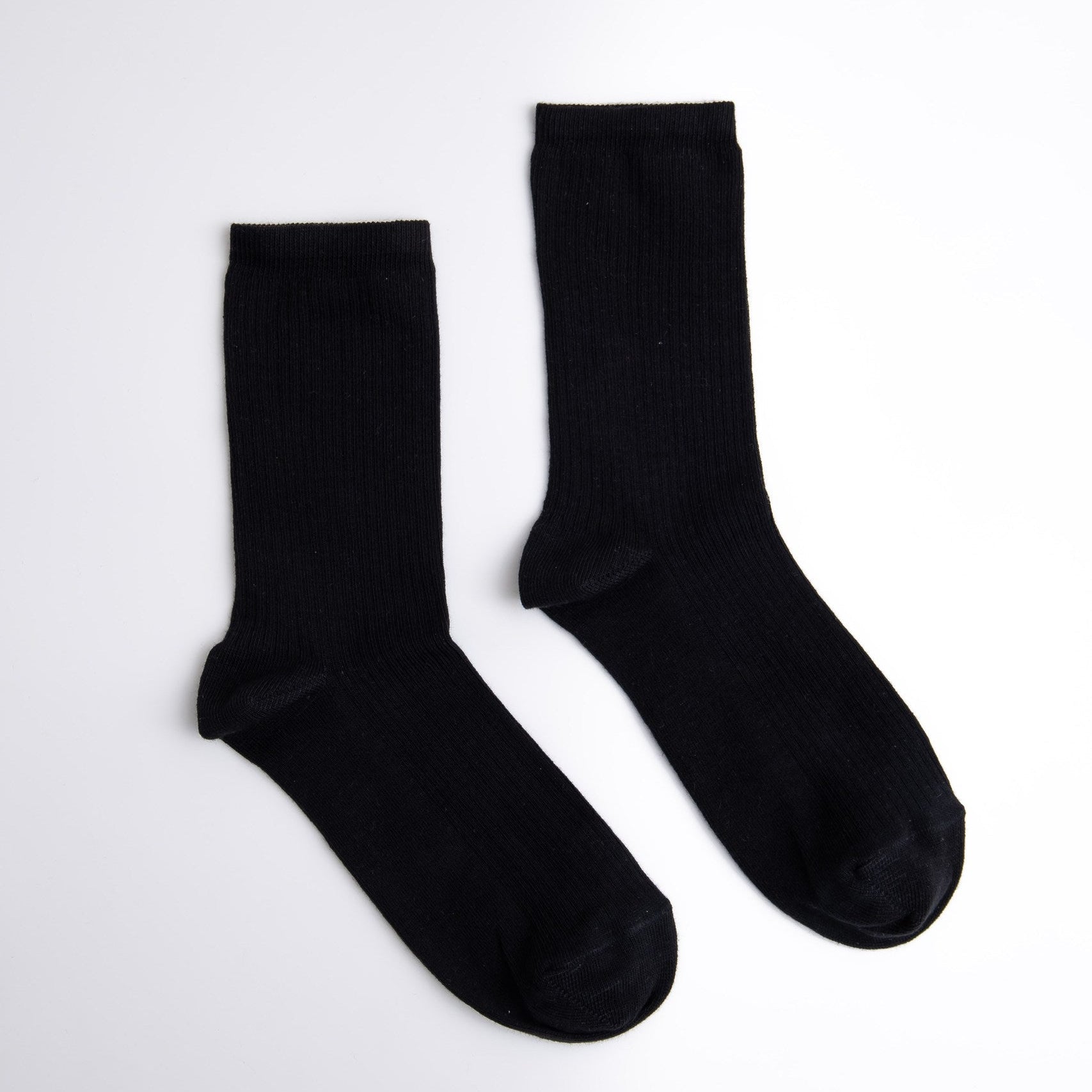 Pair of black socks on a white background

