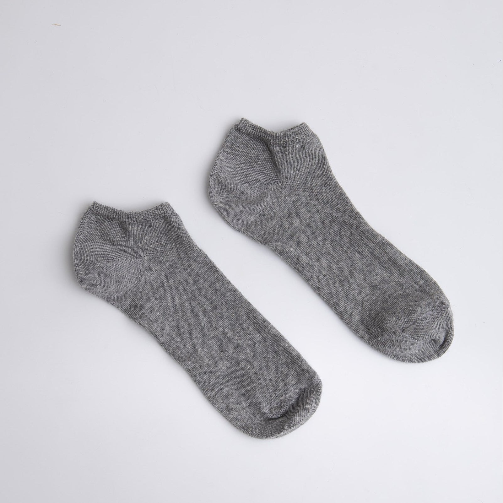 Two gray socks on a white background

