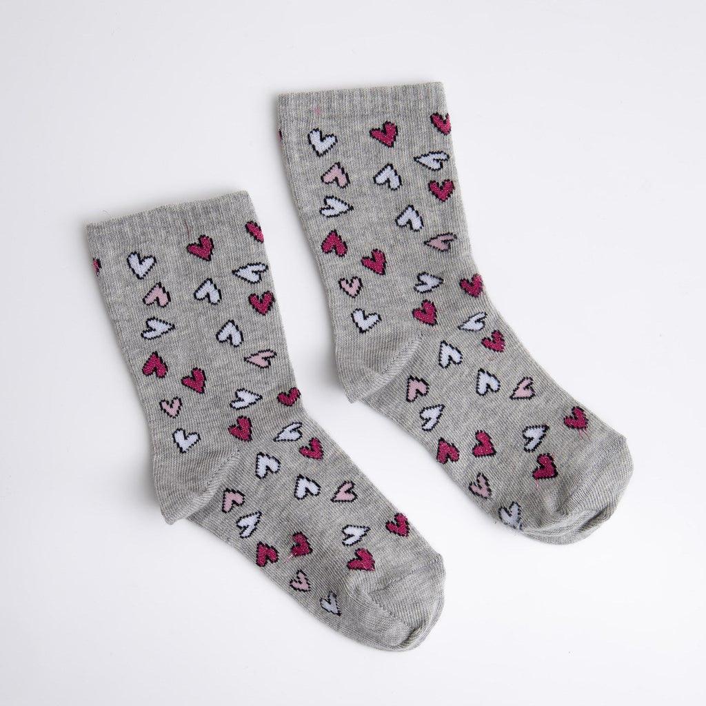 Gray socks with heart patterns on a white background

