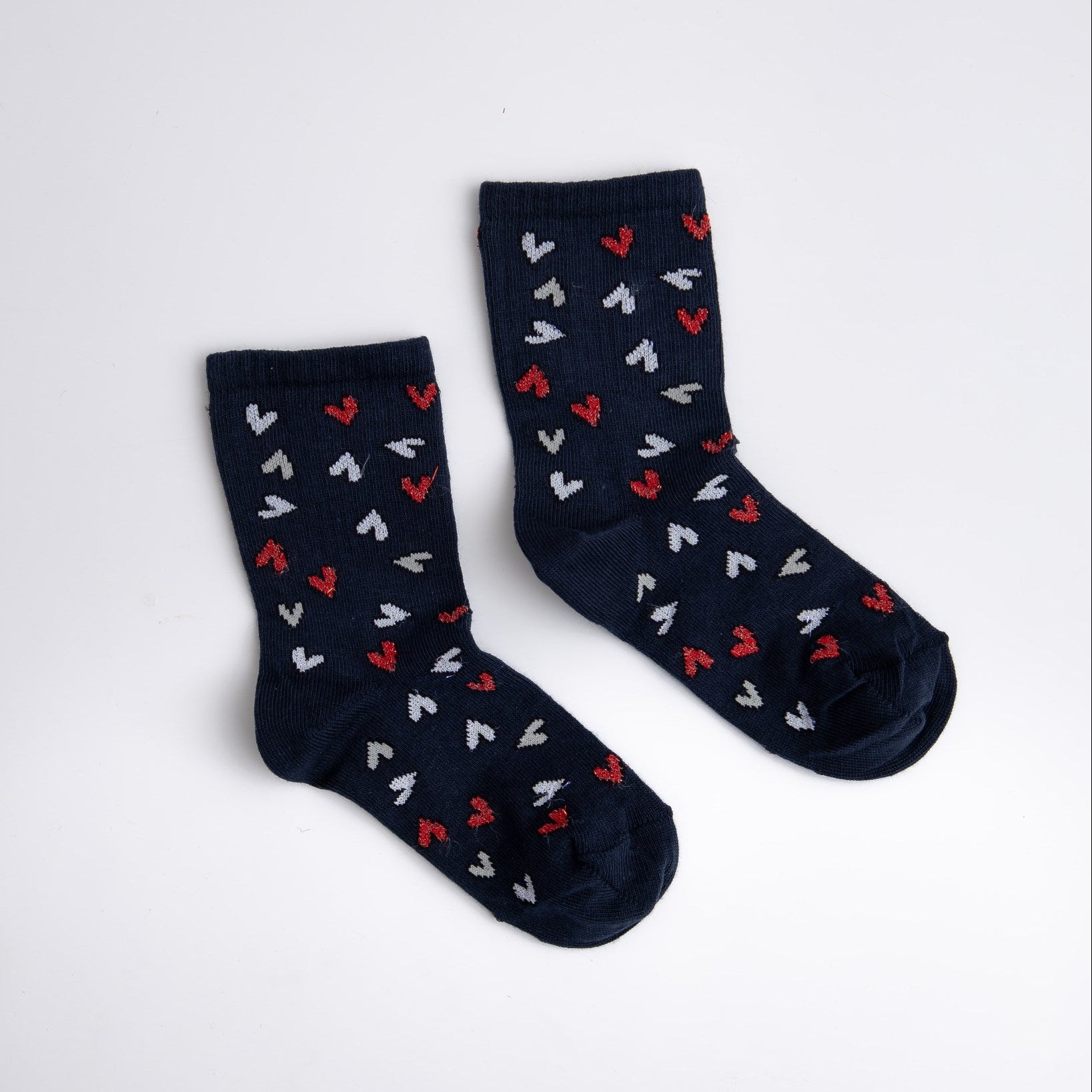 Navy socks with heart pattern on a white background

