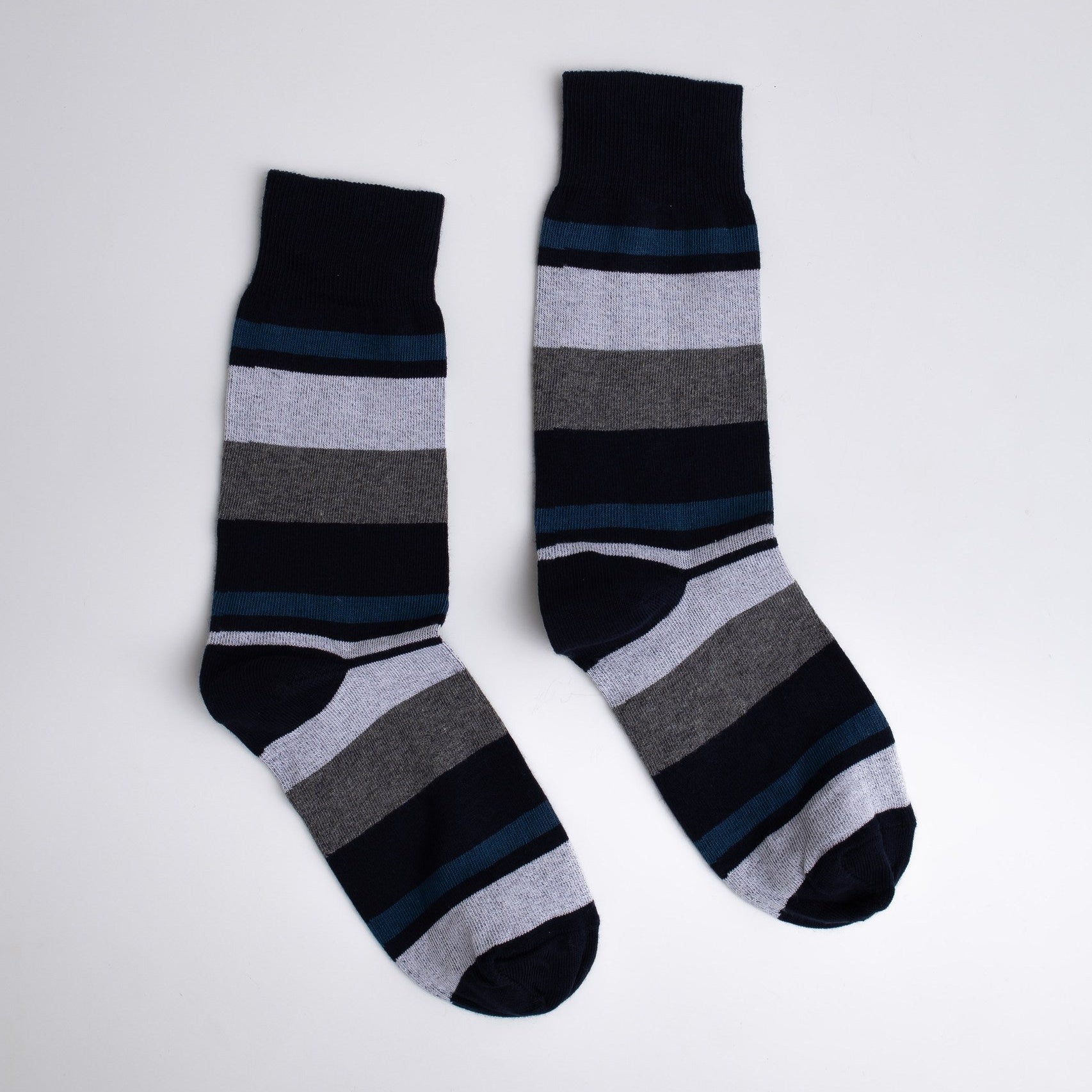 Pair of striped socks on a light gray background

