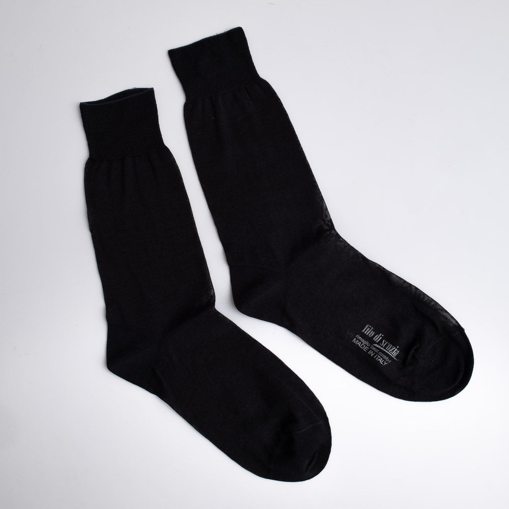 Pair of black socks on a white background


