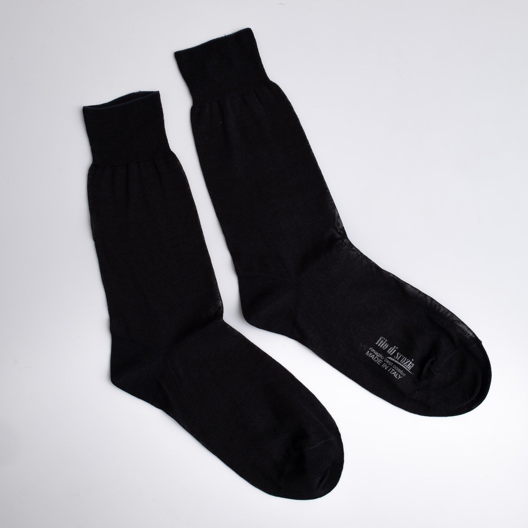 Pair of black socks on a white background

