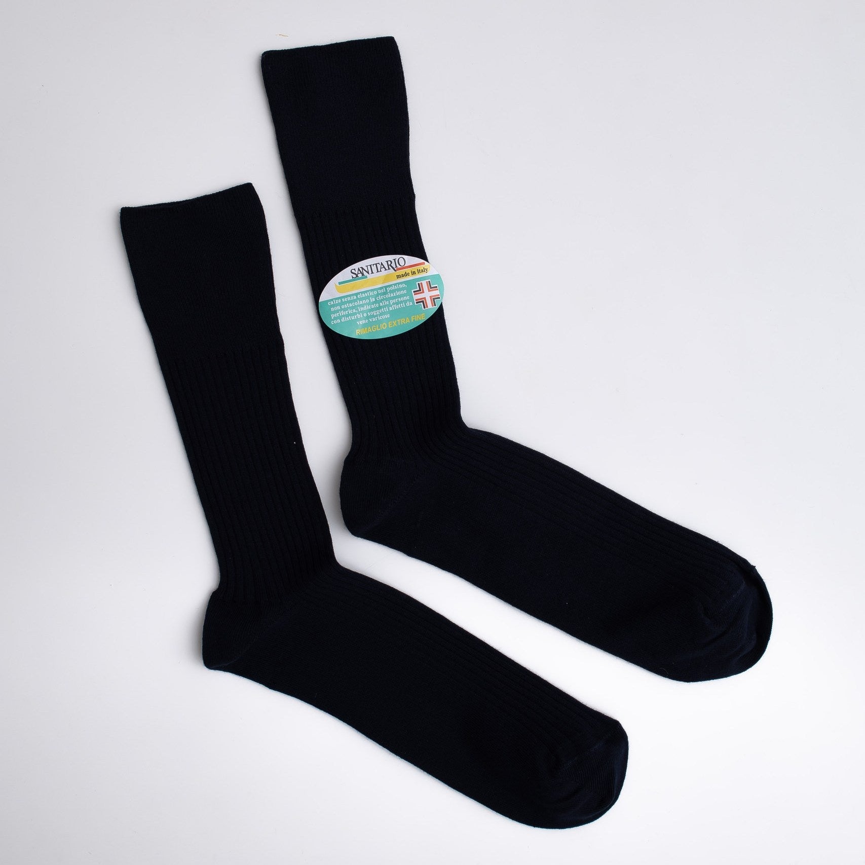 Black socks with a visible brand label on a light gray background

