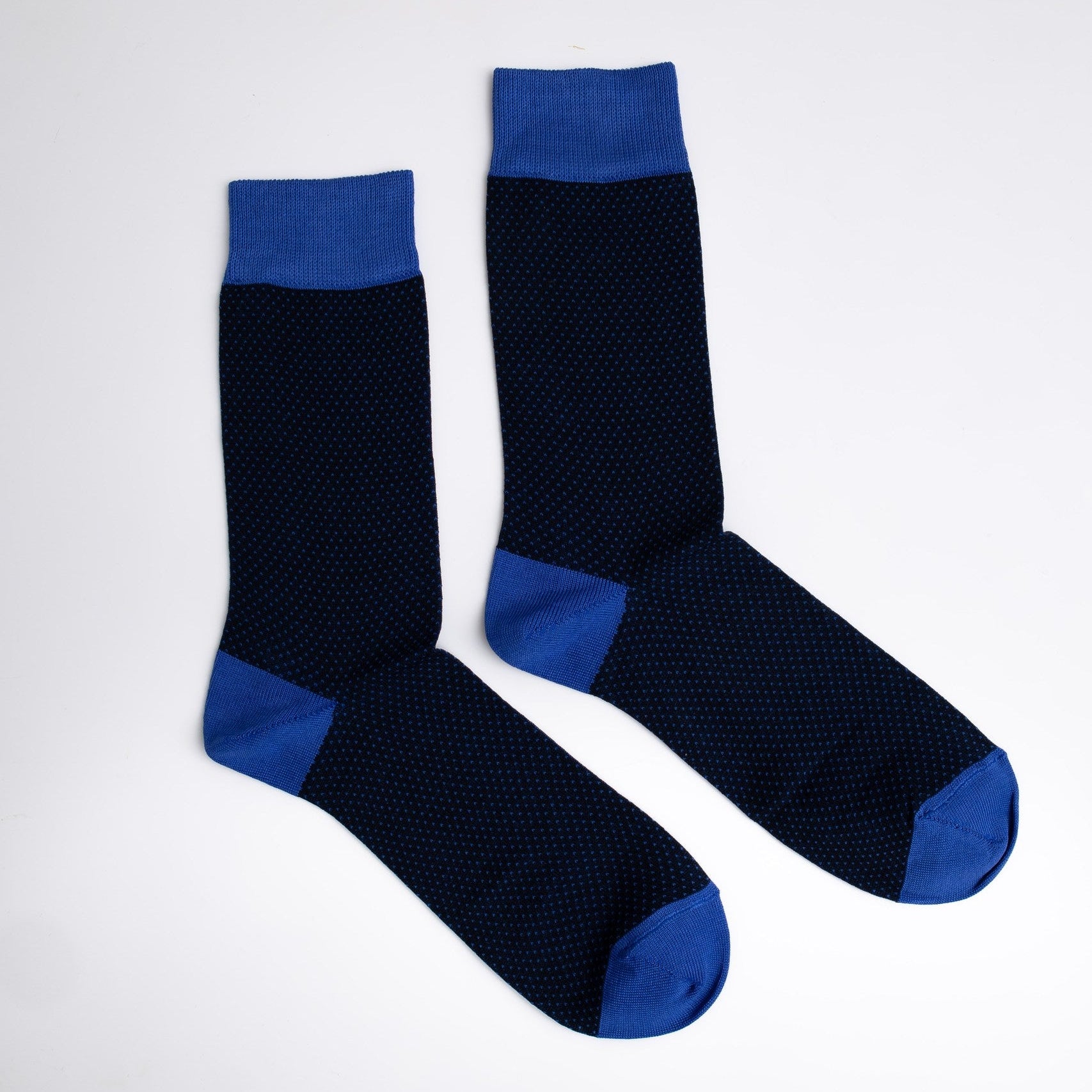 Pair of black socks with blue accents on a white background

