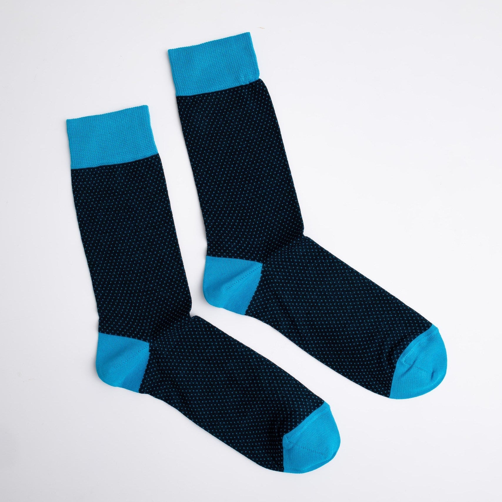 Pair of black socks with blue accents on a white background


