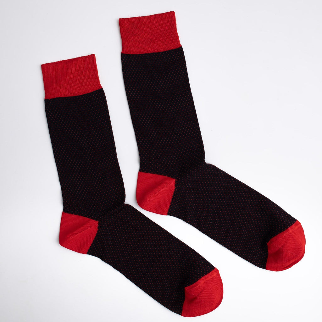 Black socks with red accents on a white background

