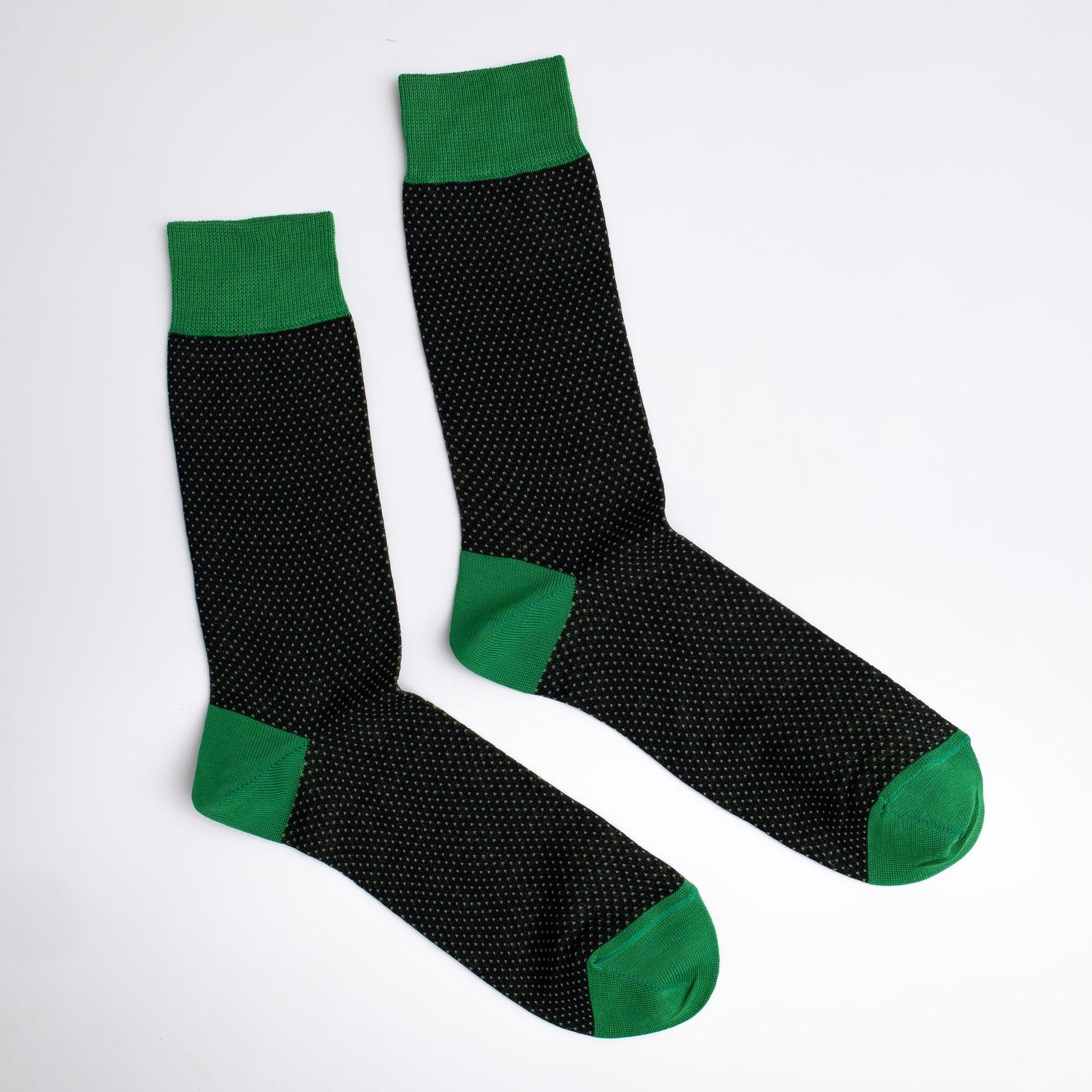 Black socks with green accents on a white background

