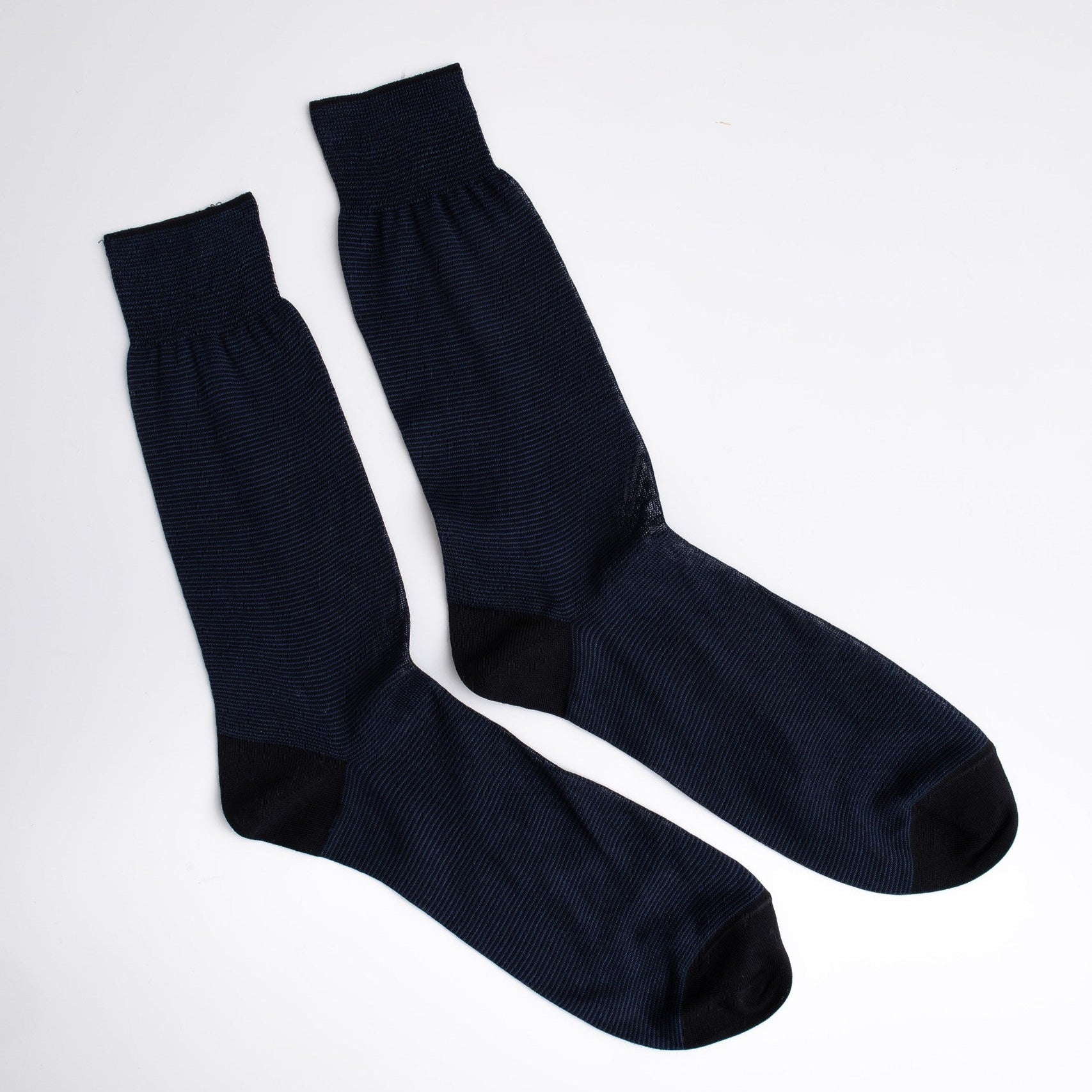 Pair of blue socks on a white background

