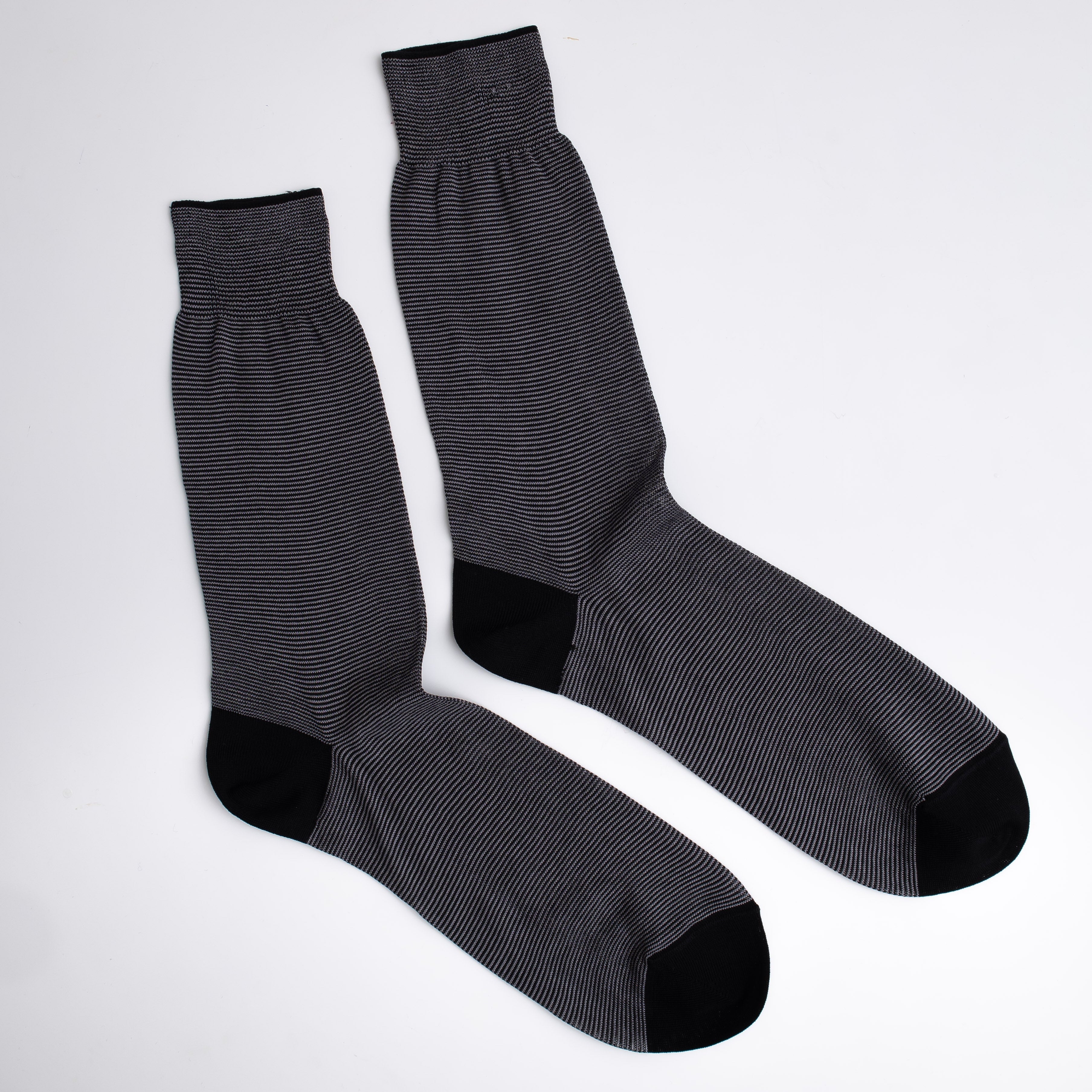 Pair of gray socks with black accents on a white background