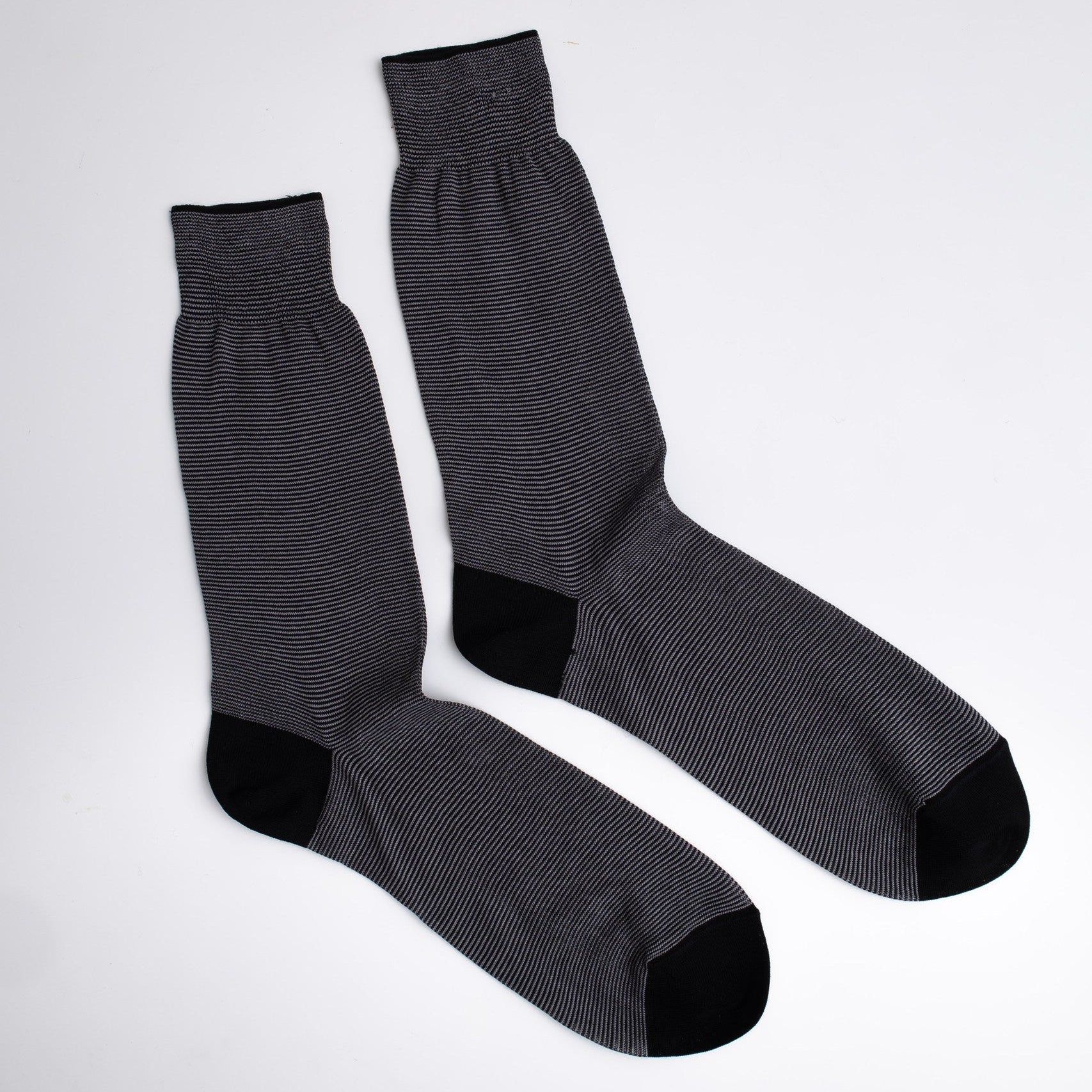 Pair of gray socks with black accents on a white background

