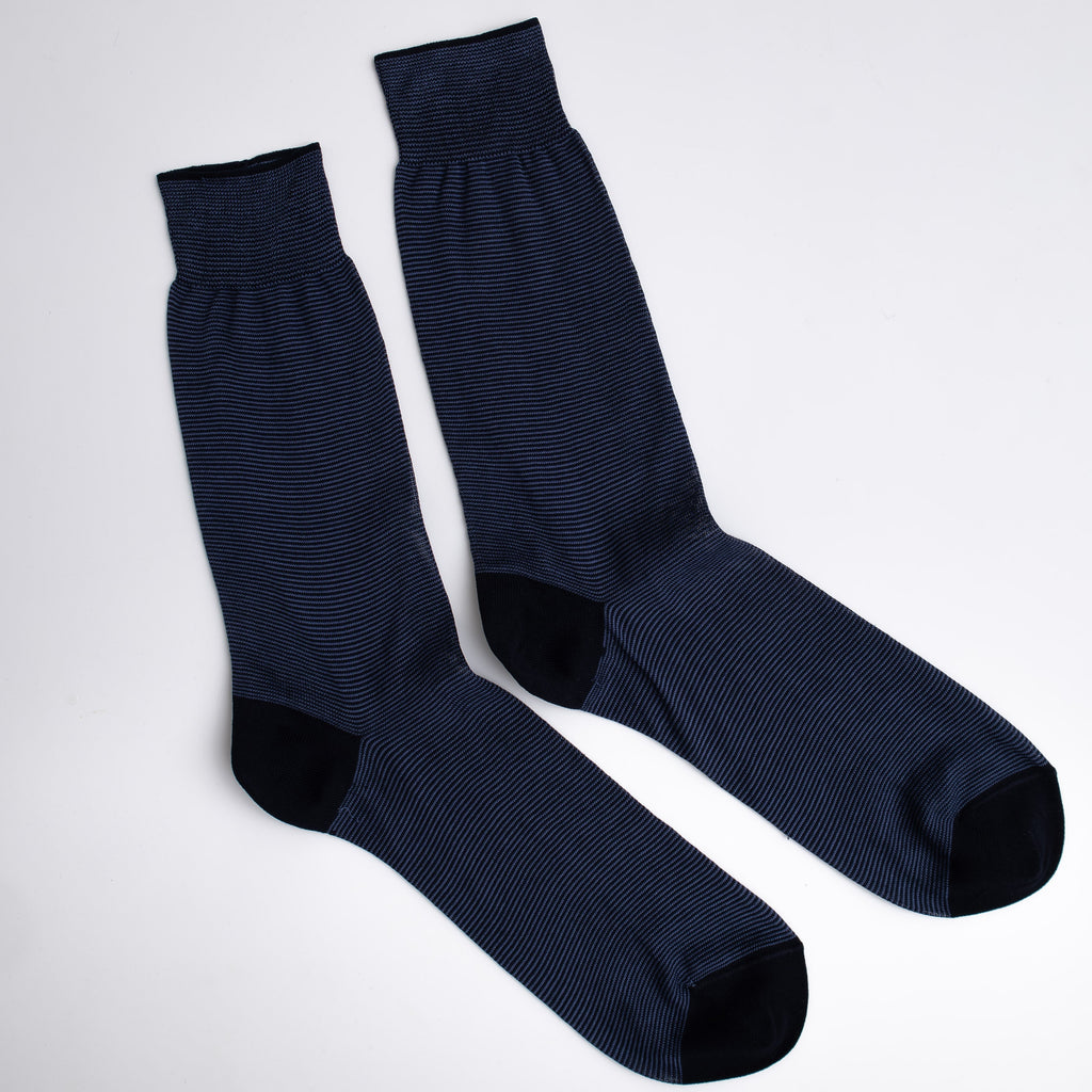 Pair of dark blue socks on a white background

