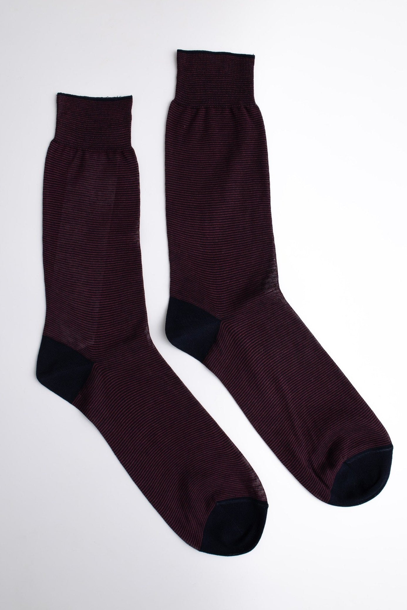 Pair of dark brown socks on a white background

