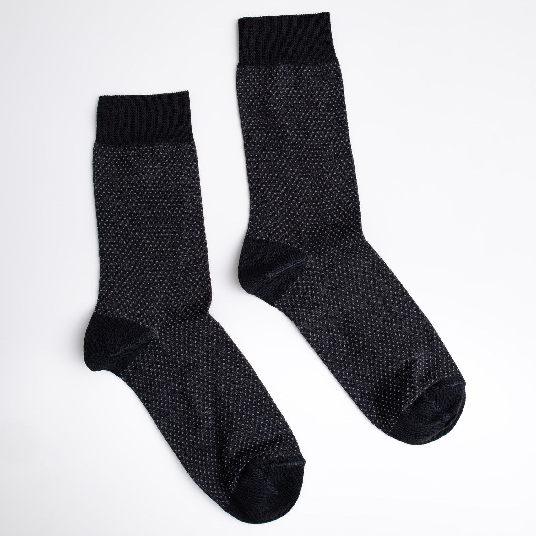Pair of black textured socks on a white background

