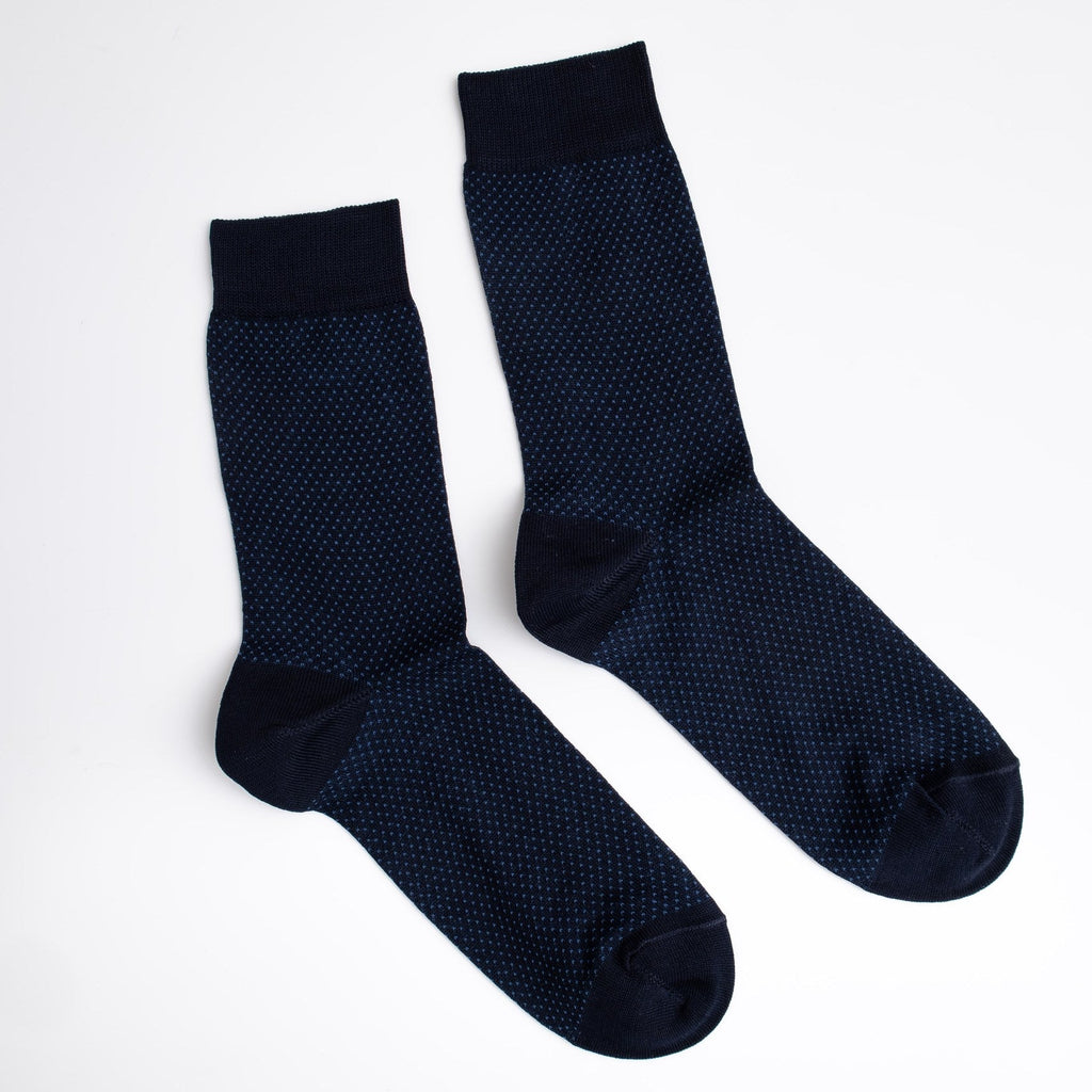 Pair of dark blue textured socks on a white background

