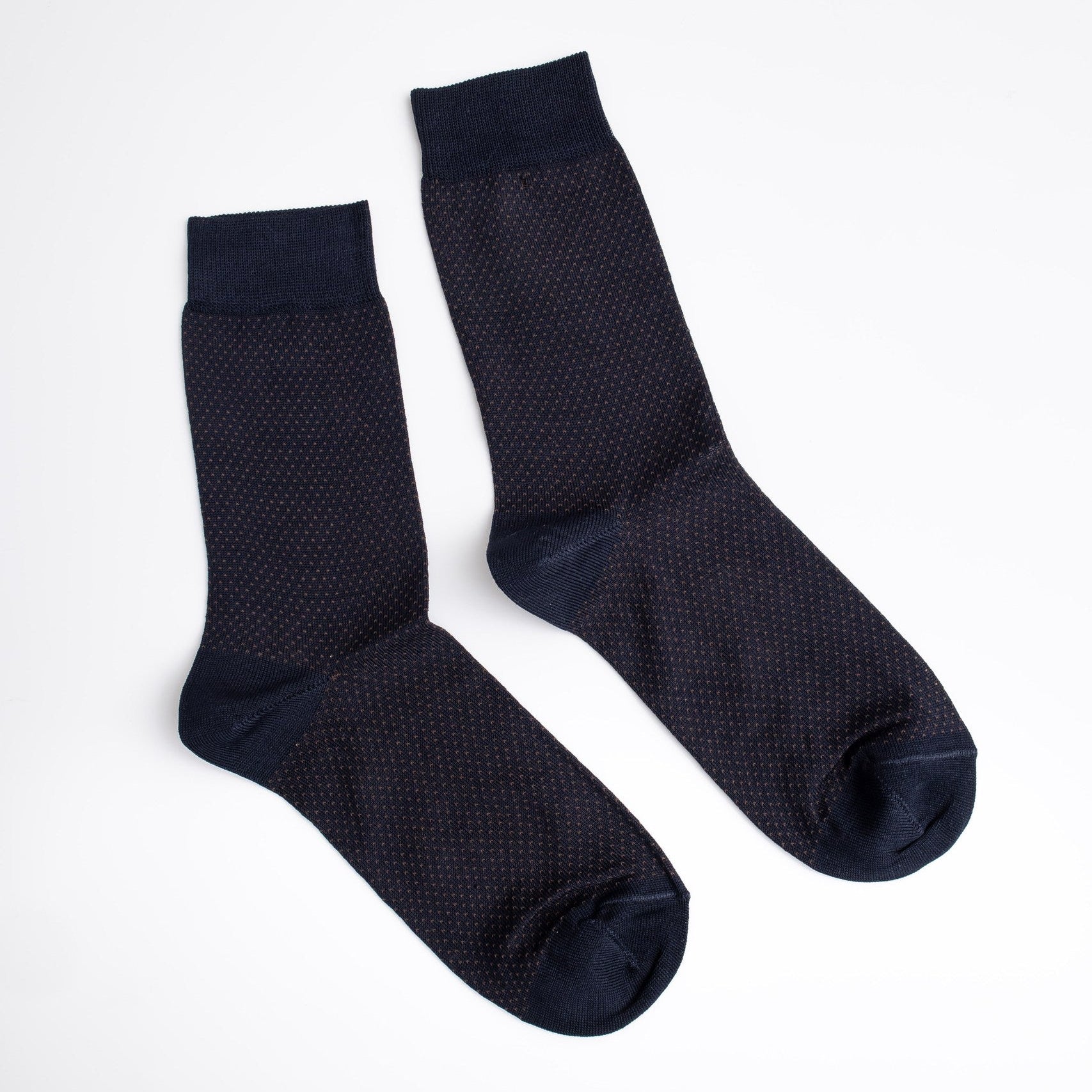 Pair of dark blue textured socks on a white background

