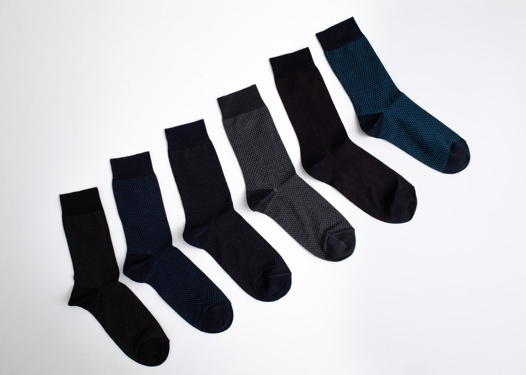 Set of black and navy socks on a white background

