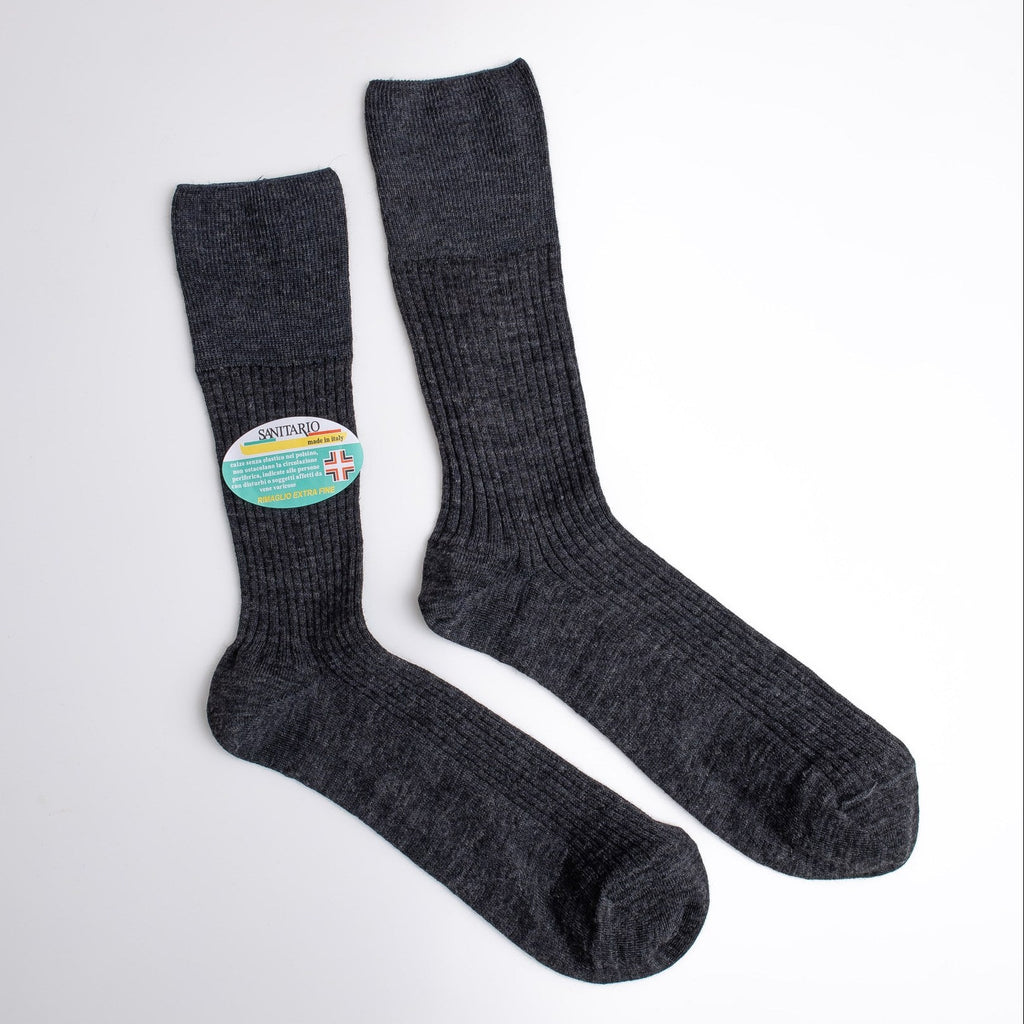 Pair of dark gray socks with a colorful logo on a white background

