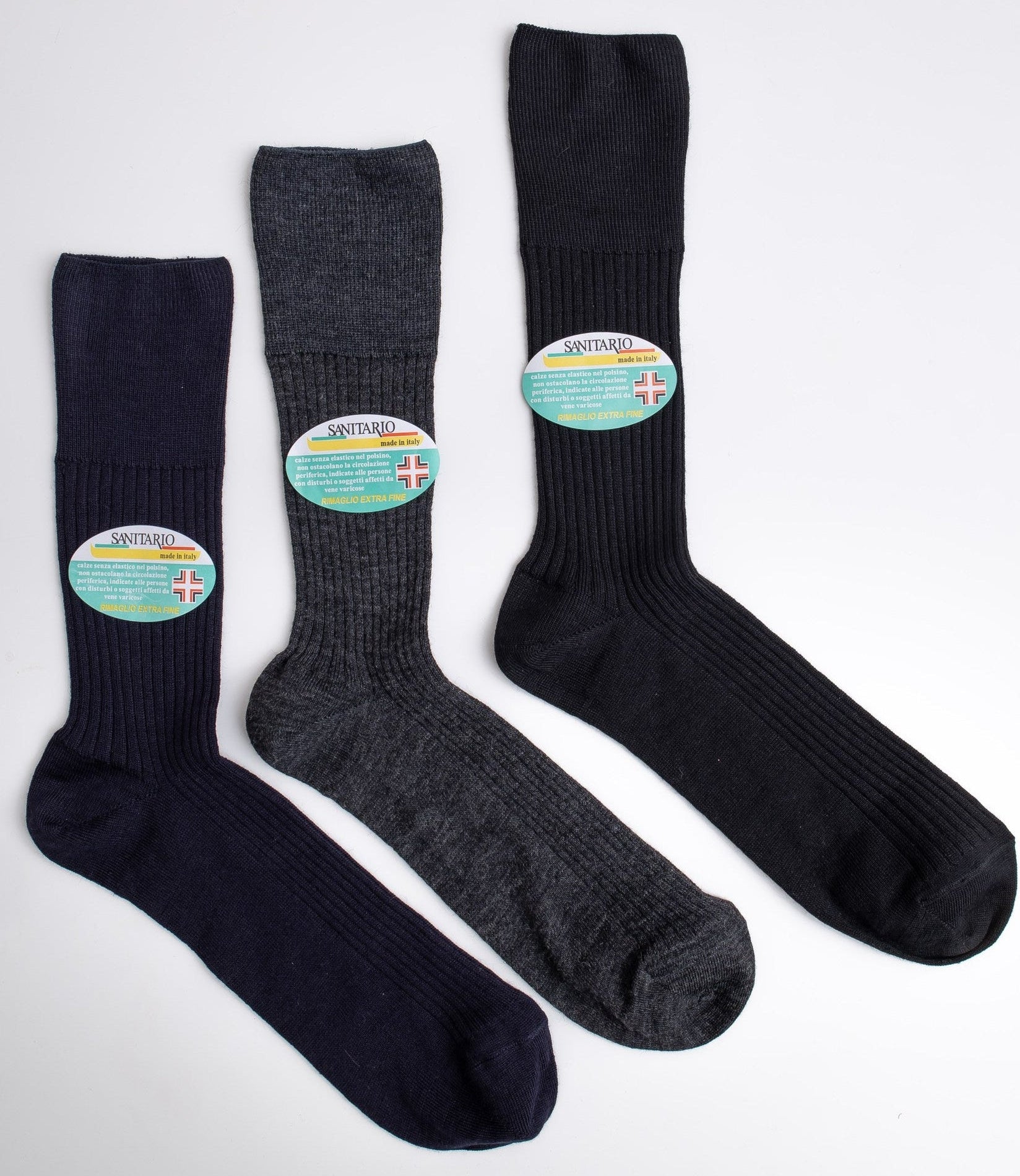 Three pairs of socks with labels on a white background

