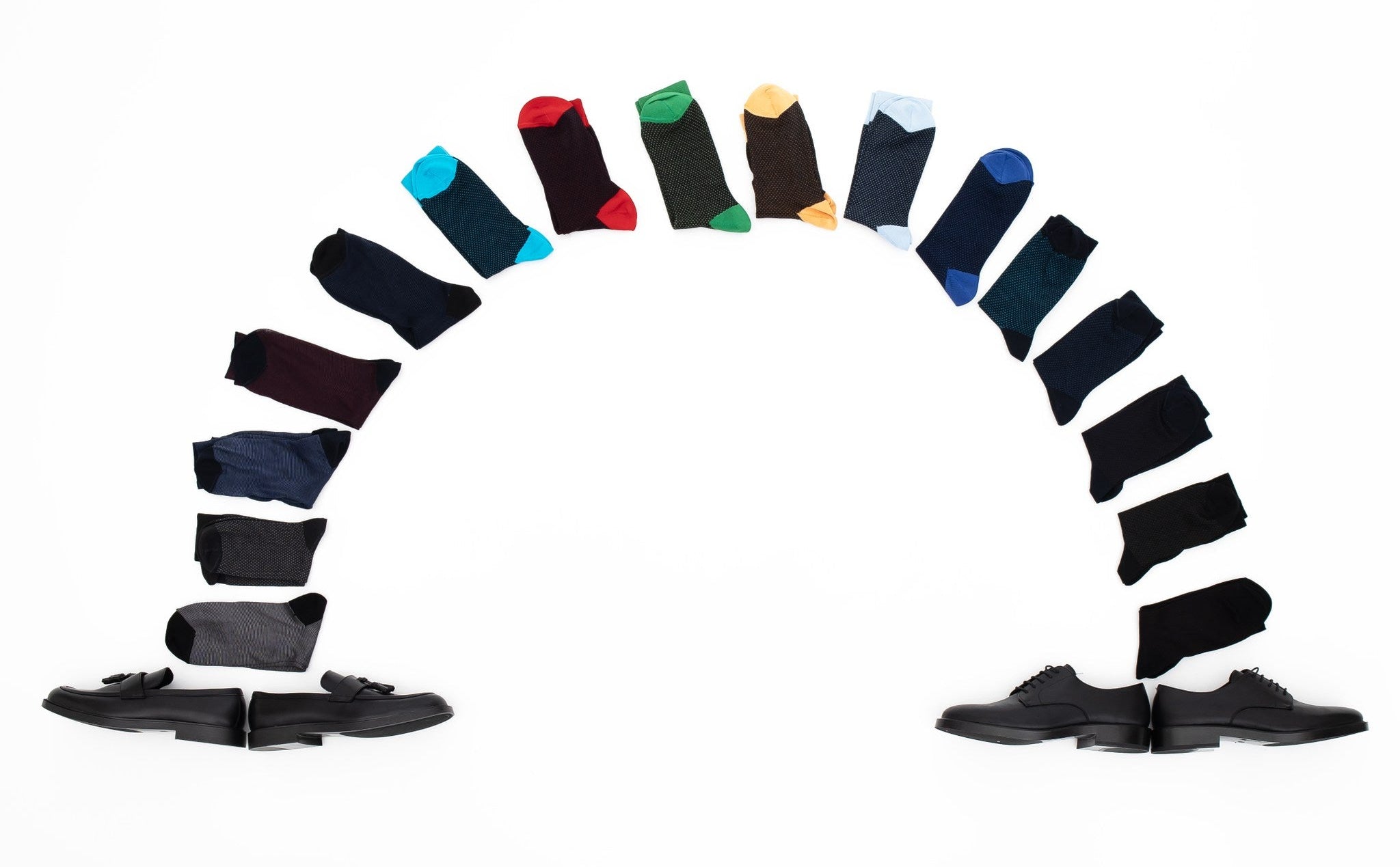 Assorted pairs of socks arranged in a circular pattern on a white background
