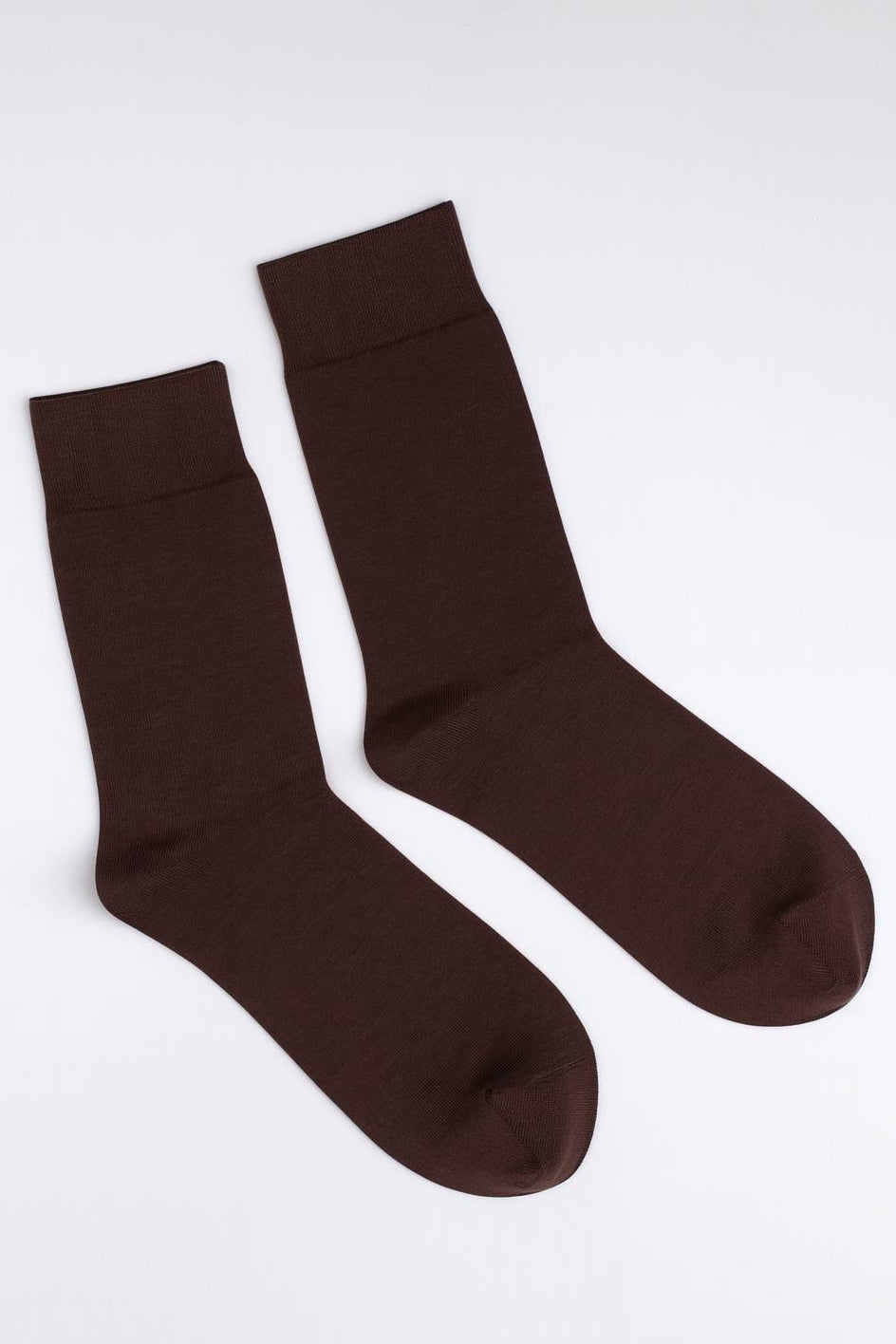 Pair of brown socks on a white background

